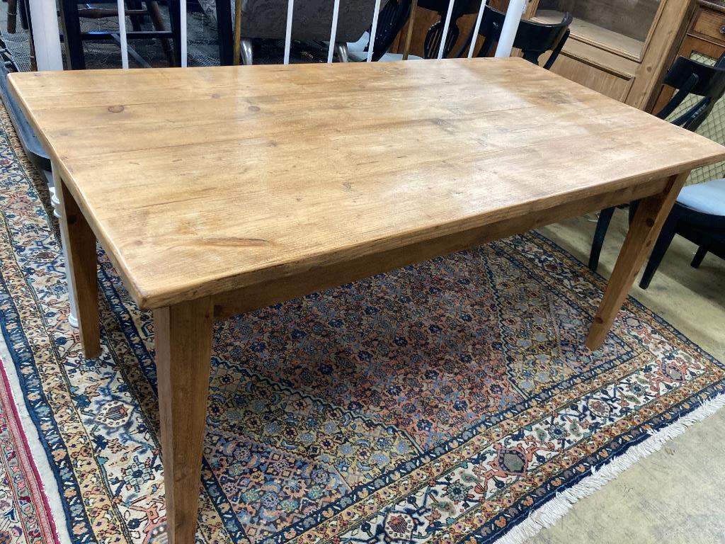 A rectangular pine kitchen table, width 160cm, depth 79cm, height 75cm